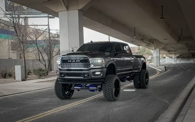 Custom wheels and tires on a lifted truck at High Rollin Customs in Reno
