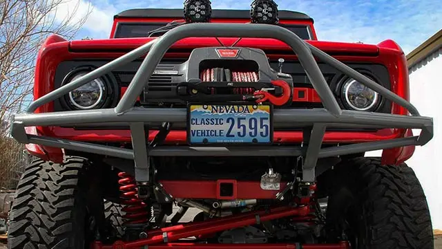 Truck with off-road bumper and accessories at High Rollin Customs